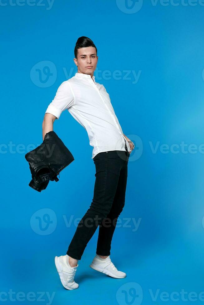 Handsome man wear black leather jacket. full length photo of a young casual man