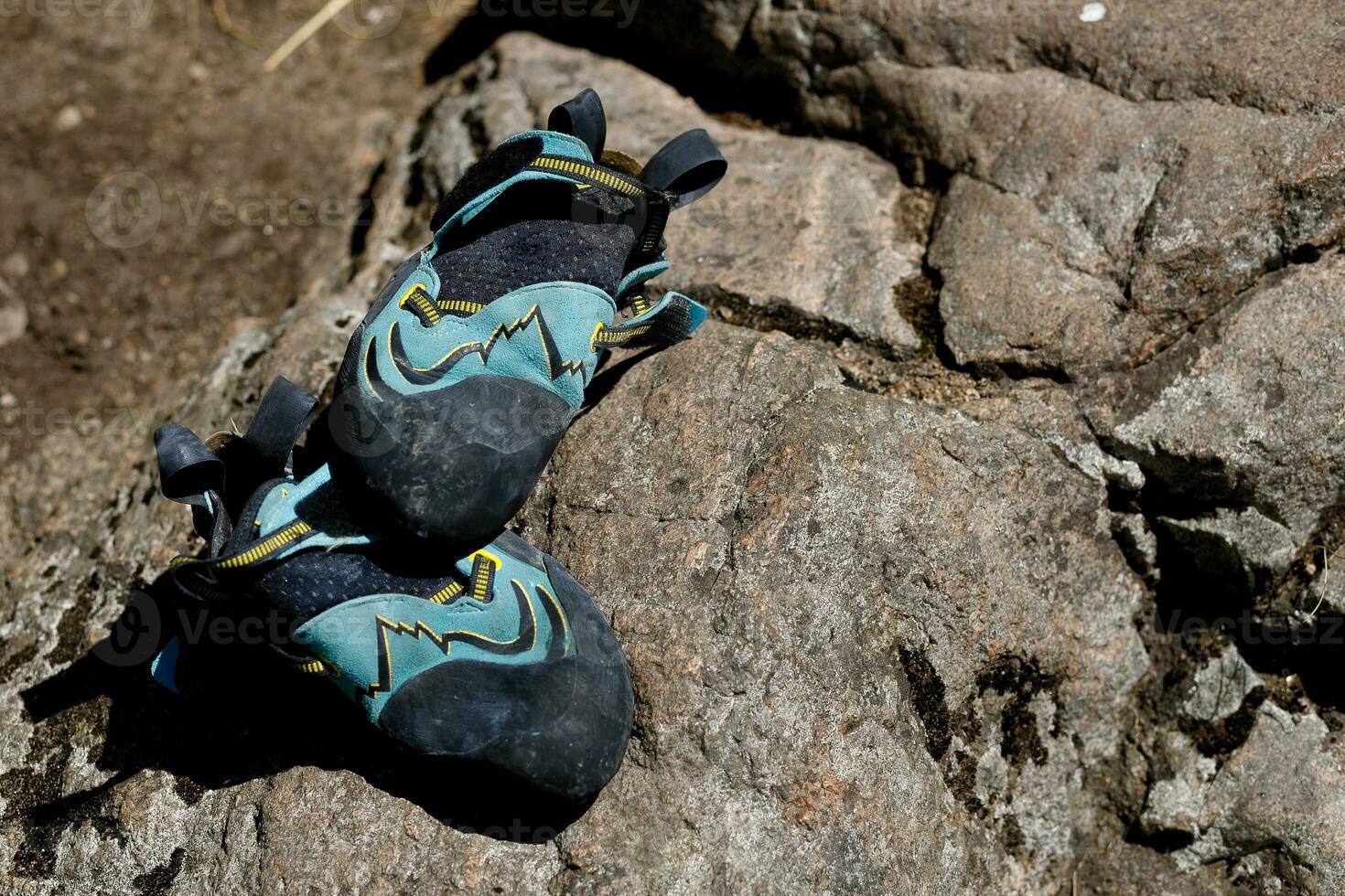 climbing shoes lie on the stone photo