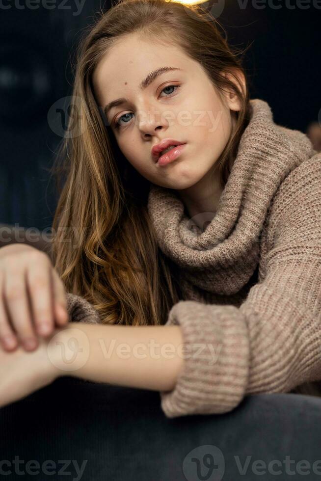 little girl in brown sweater photo