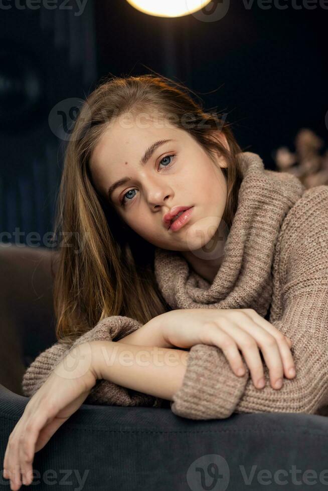 little girl in brown sweater photo