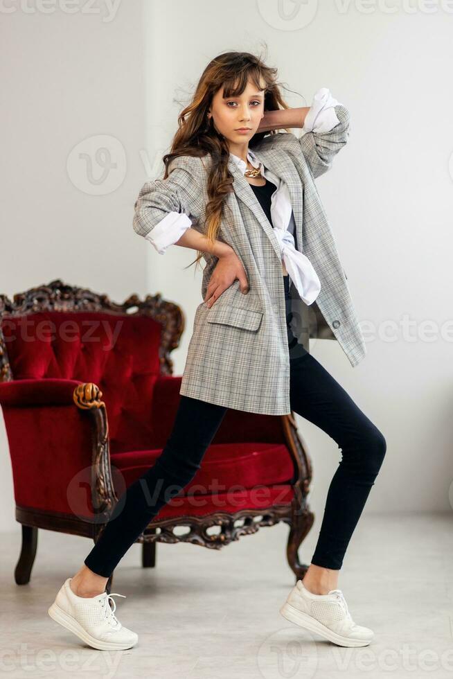 little girl in a gray jacket photo