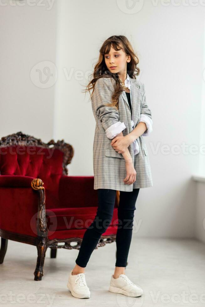 little girl in a gray jacket photo