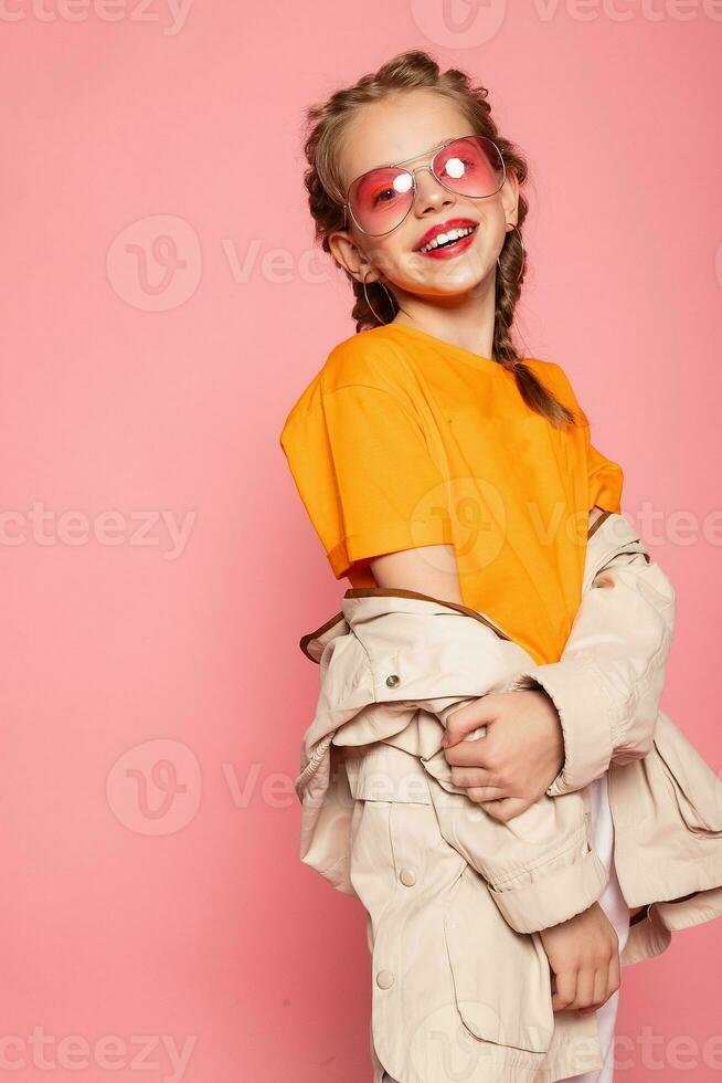 little girl in pink glasses. photo