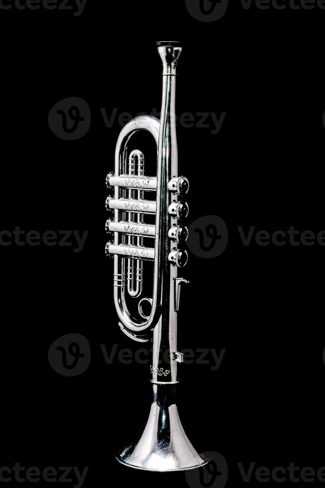 a silver trumpet on a black background photo