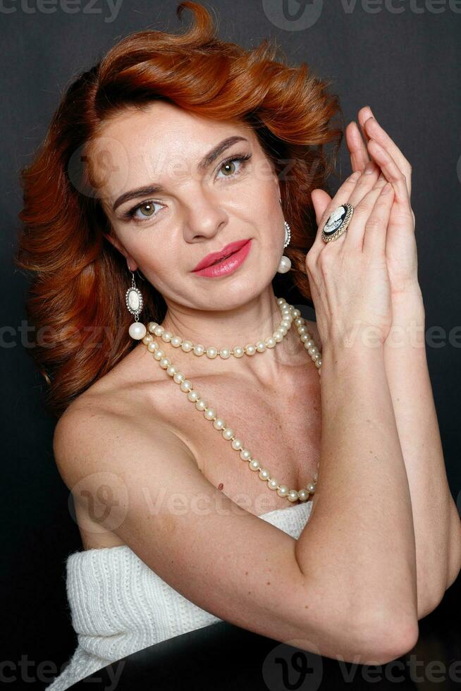portrait of a beautiful brunette girl with luxury accessories photo
