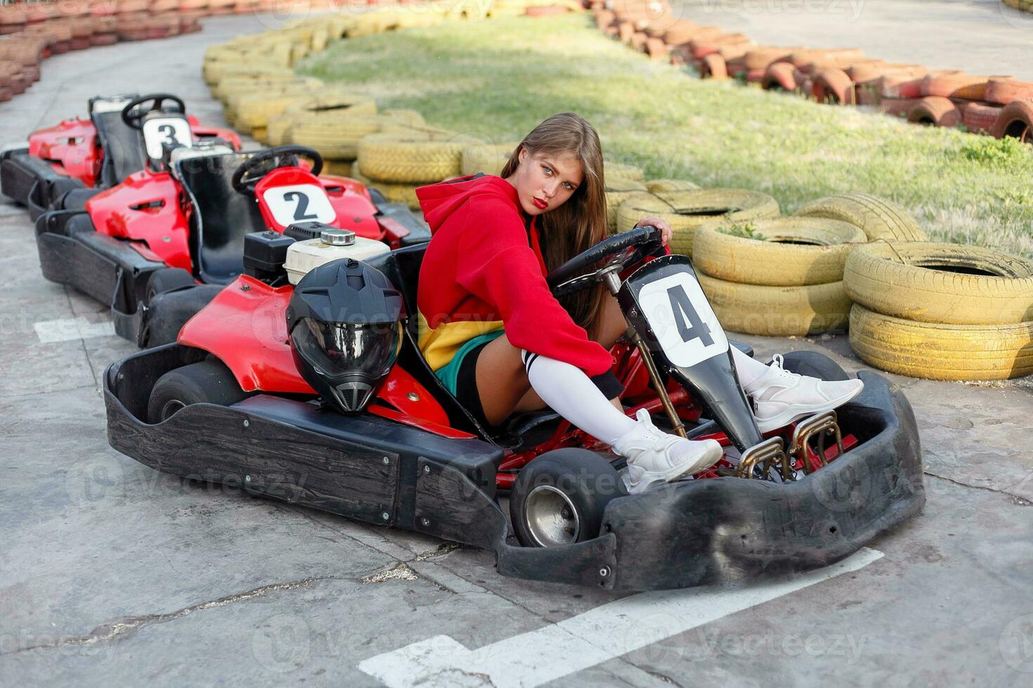 happy brunette women wining the karting race. photo