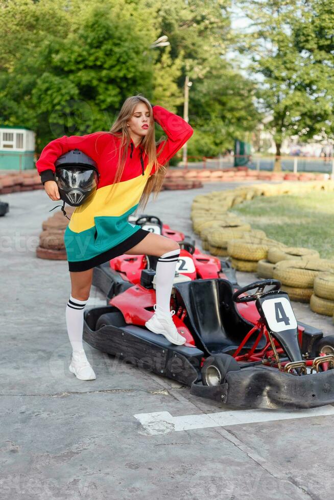 happy brunette women wining the karting race. photo