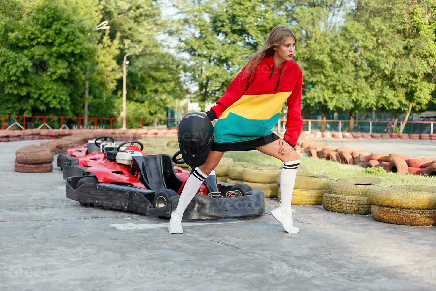 happy brunette women wining the karting race. photo