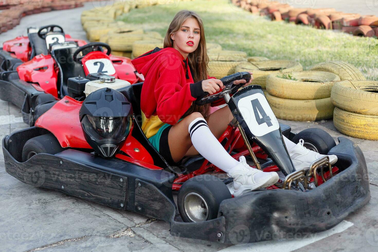 happy brunette women wining the karting race. photo