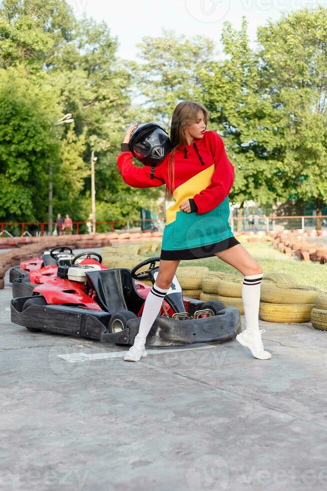 happy brunette women wining the karting race. photo