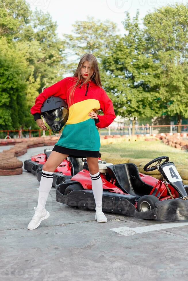 happy brunette women wining the karting race. photo