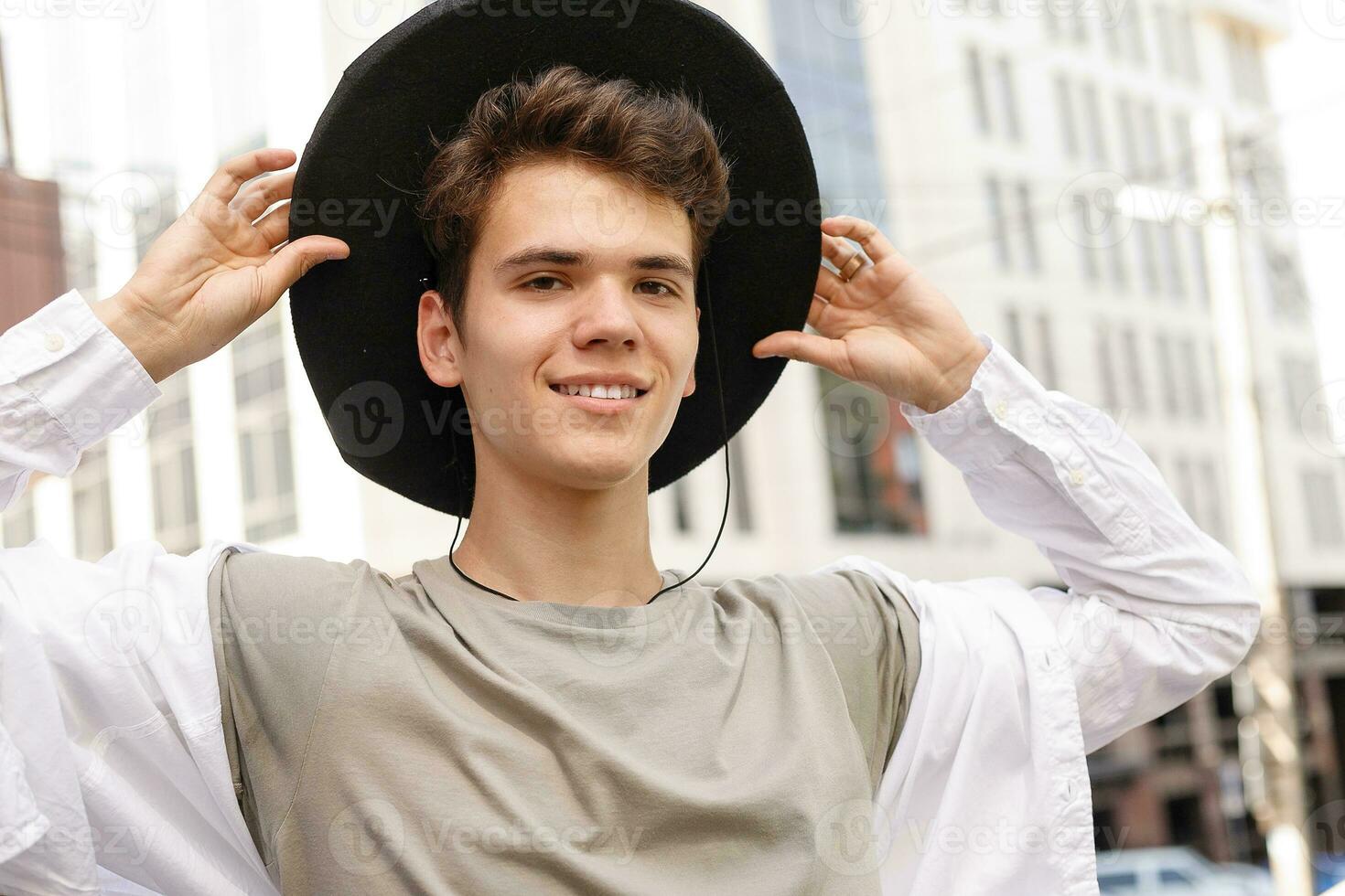 portrait of a trendy young man in the city photo