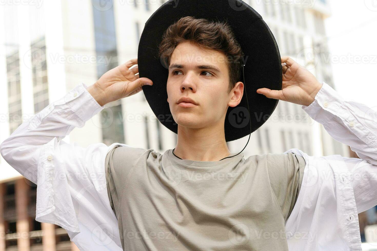 portrait of a trendy young man in the city photo