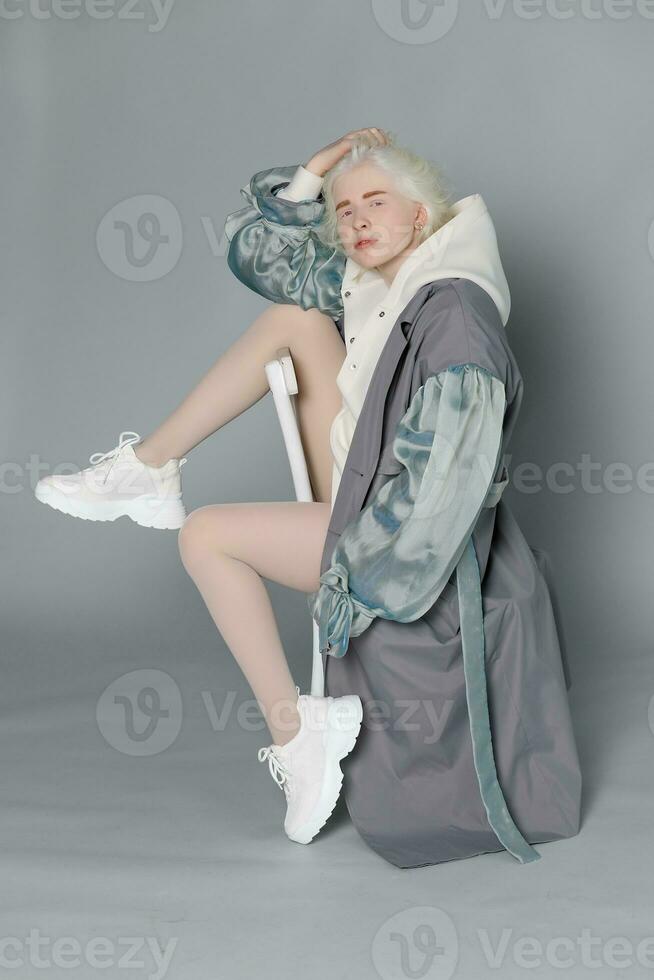 beautiful albino girl with white skin, natural lips and white hair photo