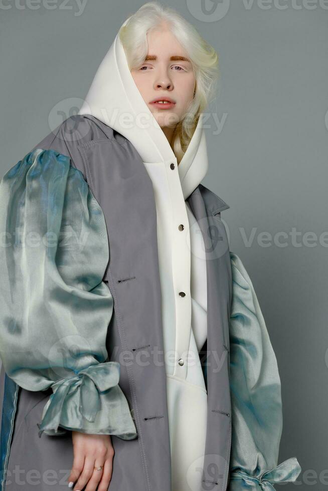 beautiful albino girl with white skin, natural lips and white hair photo