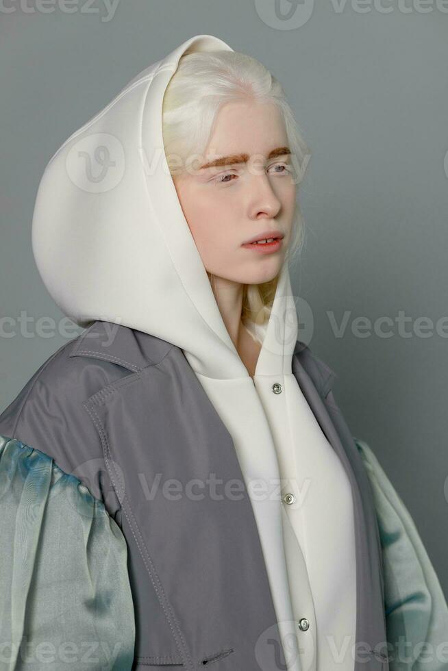 beautiful albino girl with white skin, natural lips and white hair photo