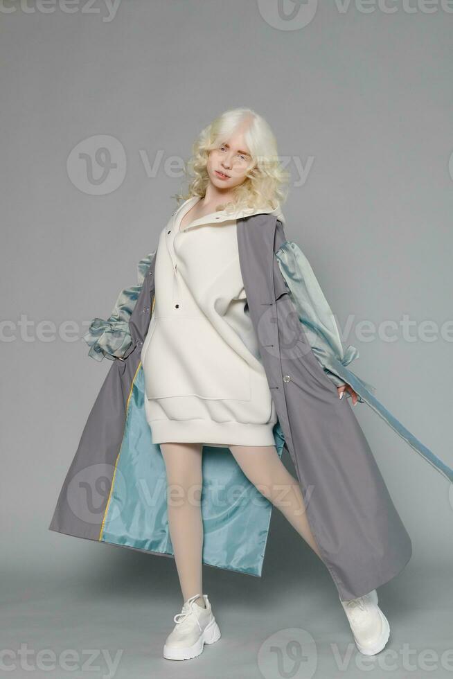 beautiful albino girl with white skin, natural lips and white hair photo