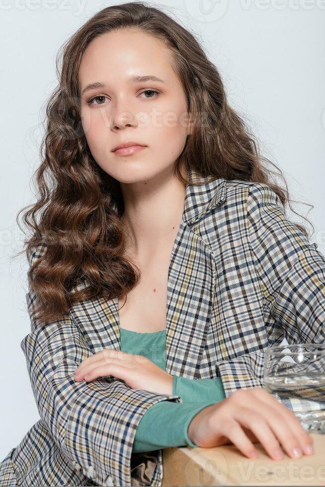 Young woman portrait with water glass. White background isolated. photo