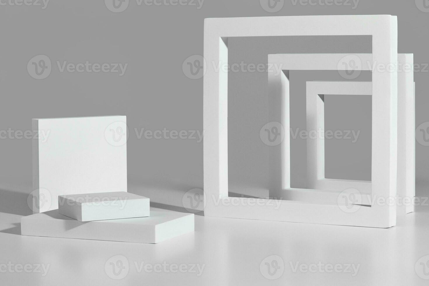 Podium for product presentation of square platforms and frames on gray photo