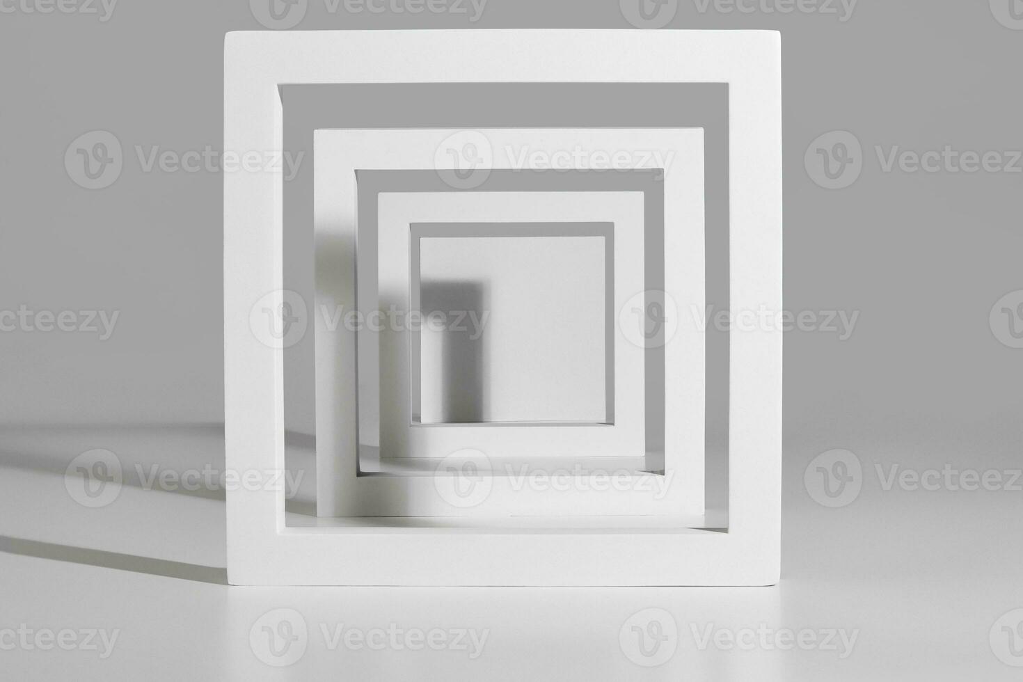 Podium for product presentation from square frames on gray background photo