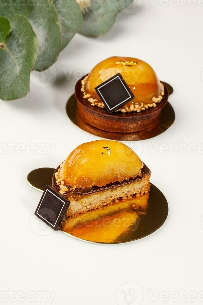 Shortbread tartlets with almond cream, chocolate, caramelized apples photo