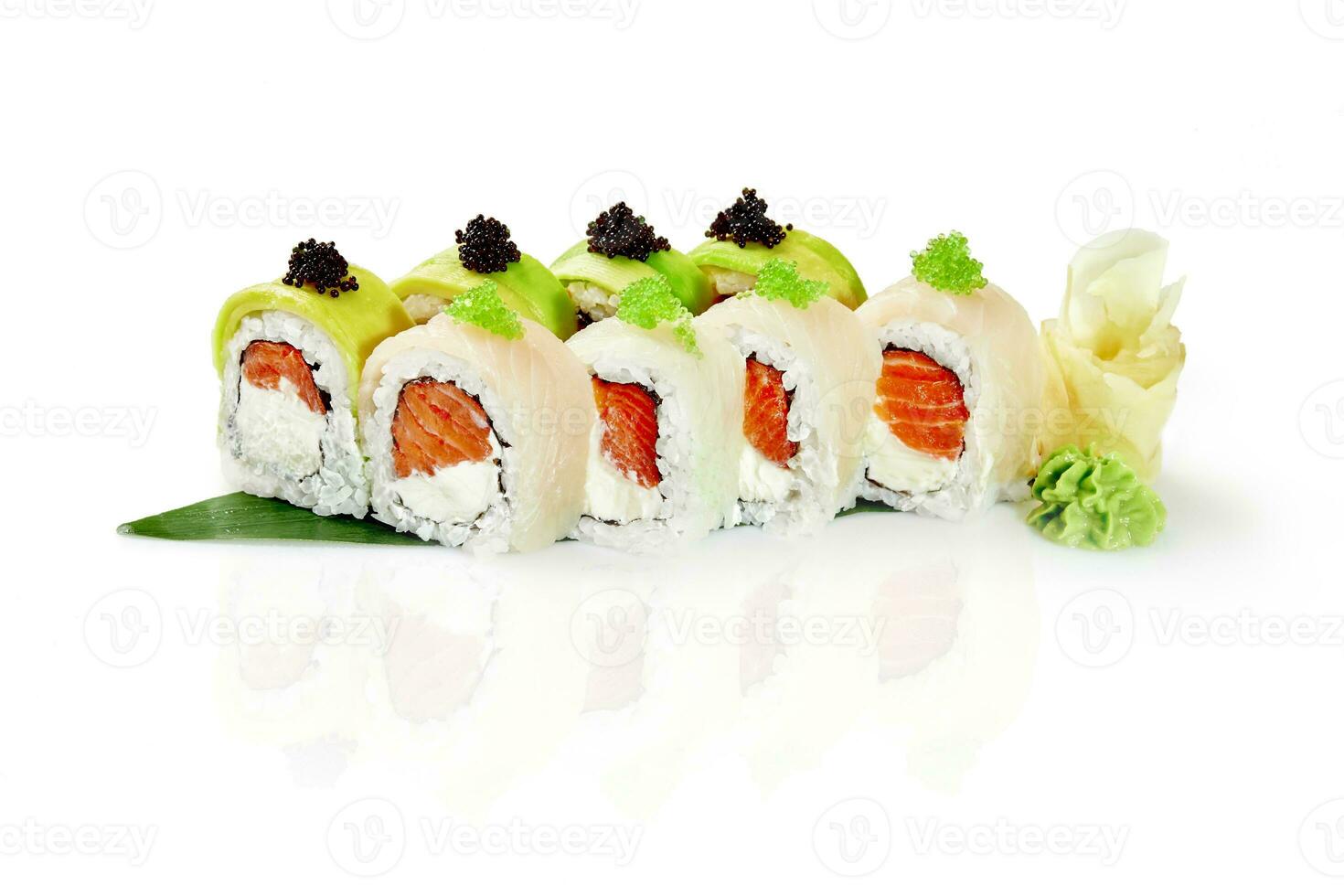 Rolls with cream cheese and salmon wrapped in avocado and sea bass photo