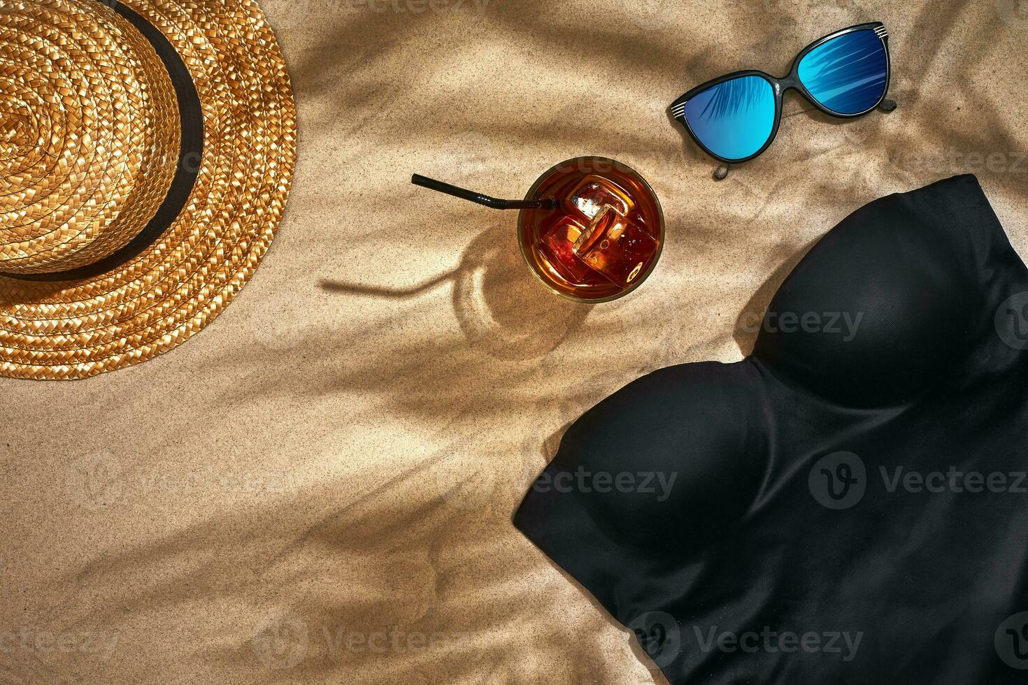 Top view of summer accessories on sandy beach photo