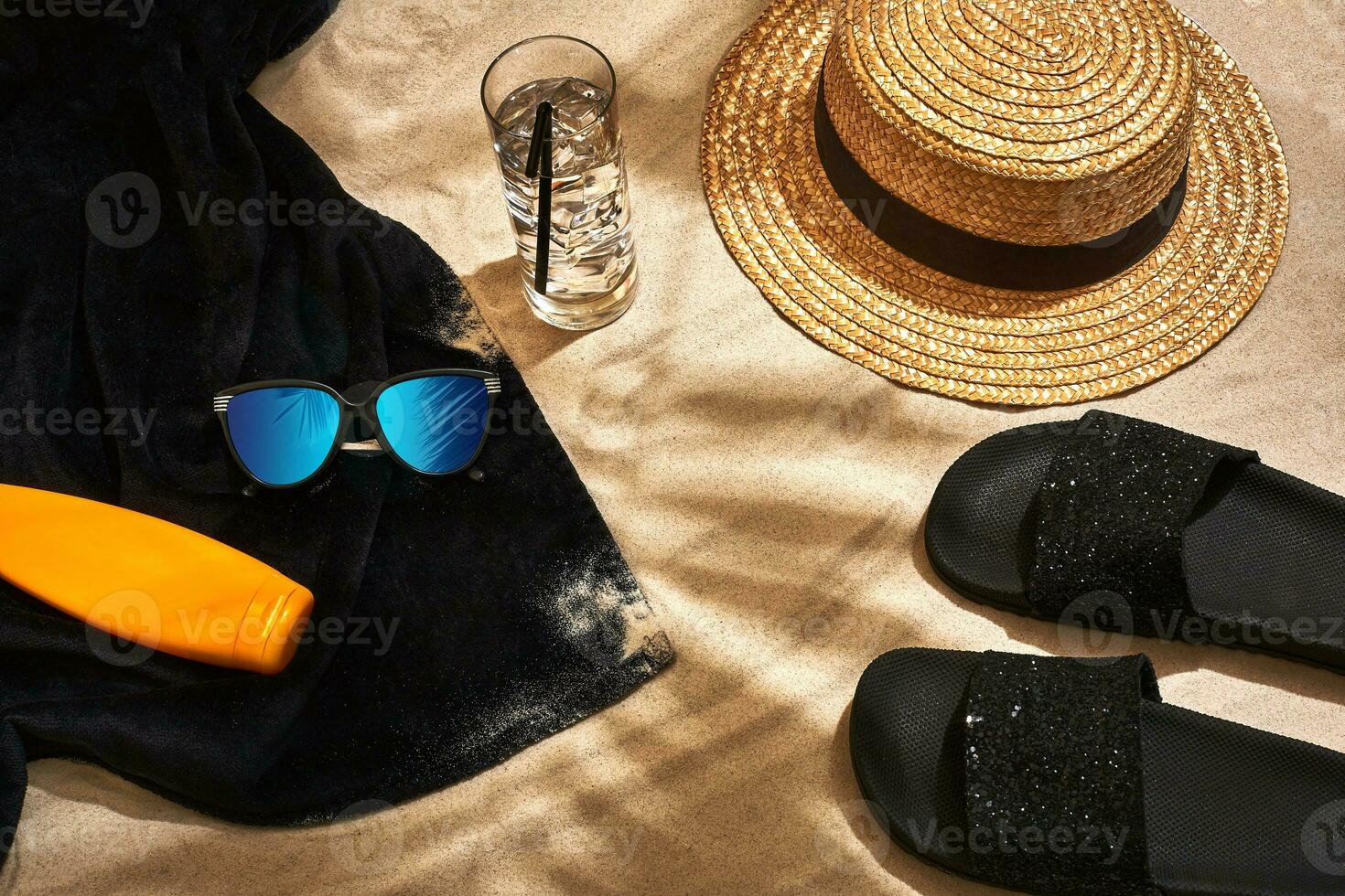 Summer background with straw hat, sunglasses, sunscreen bottle and flip flops photo
