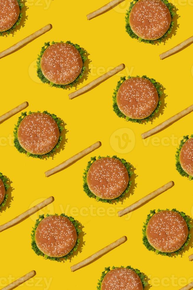 Design concept of mockup burgers and french fries set on yellow background. photo