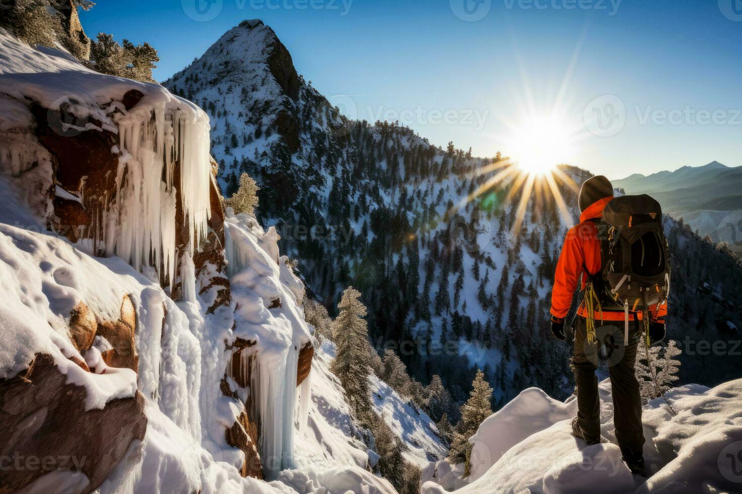 Climber gracefully navigates sunlight dappled frozen waterfall in wintry wilderness photo
