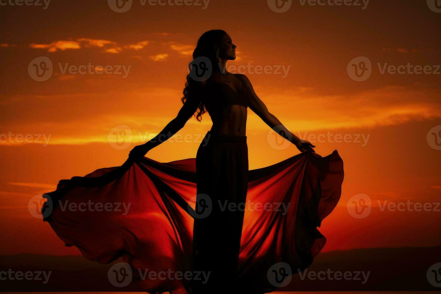 Aerial silk performer silhouetted against dramatic sky background with empty space for text photo