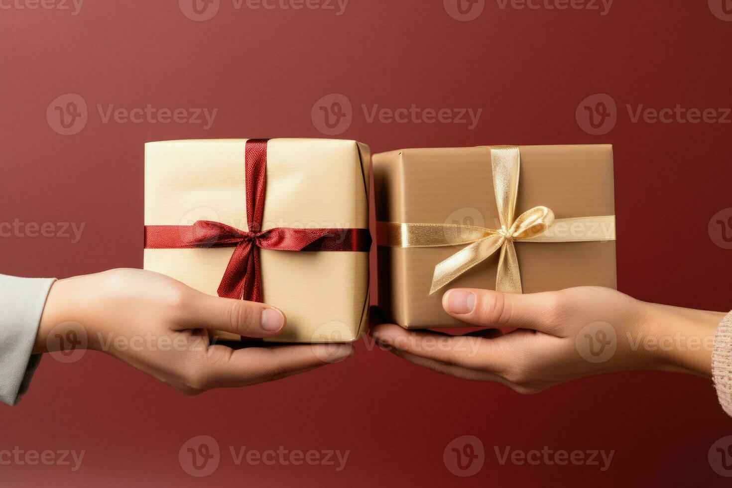 Close up of hands exchanging Christmas presents isolated on a gradient background photo