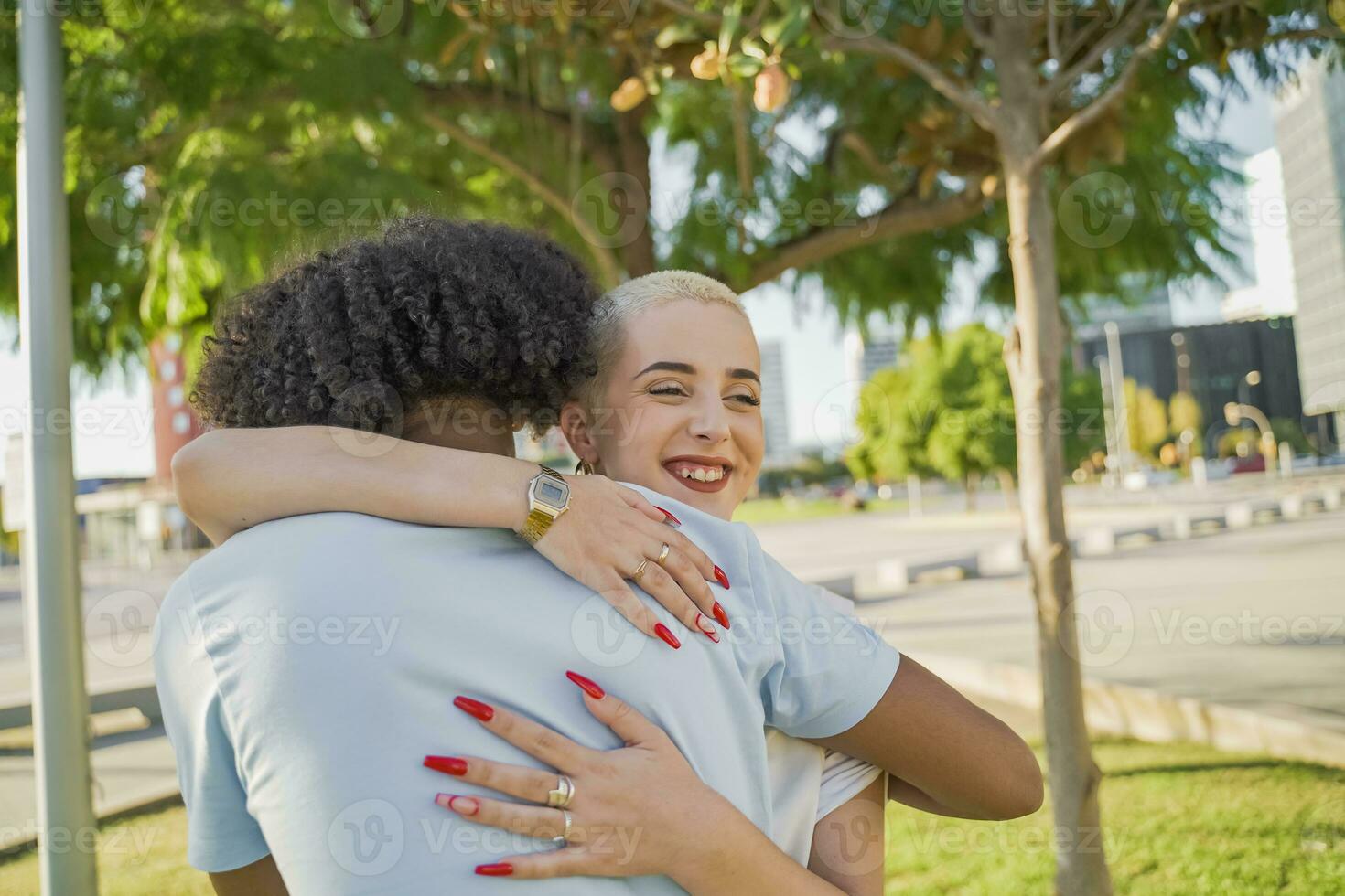 Friendly hug concept, smiling millennial man and woman cuddling, friendship and good warm relations. photo