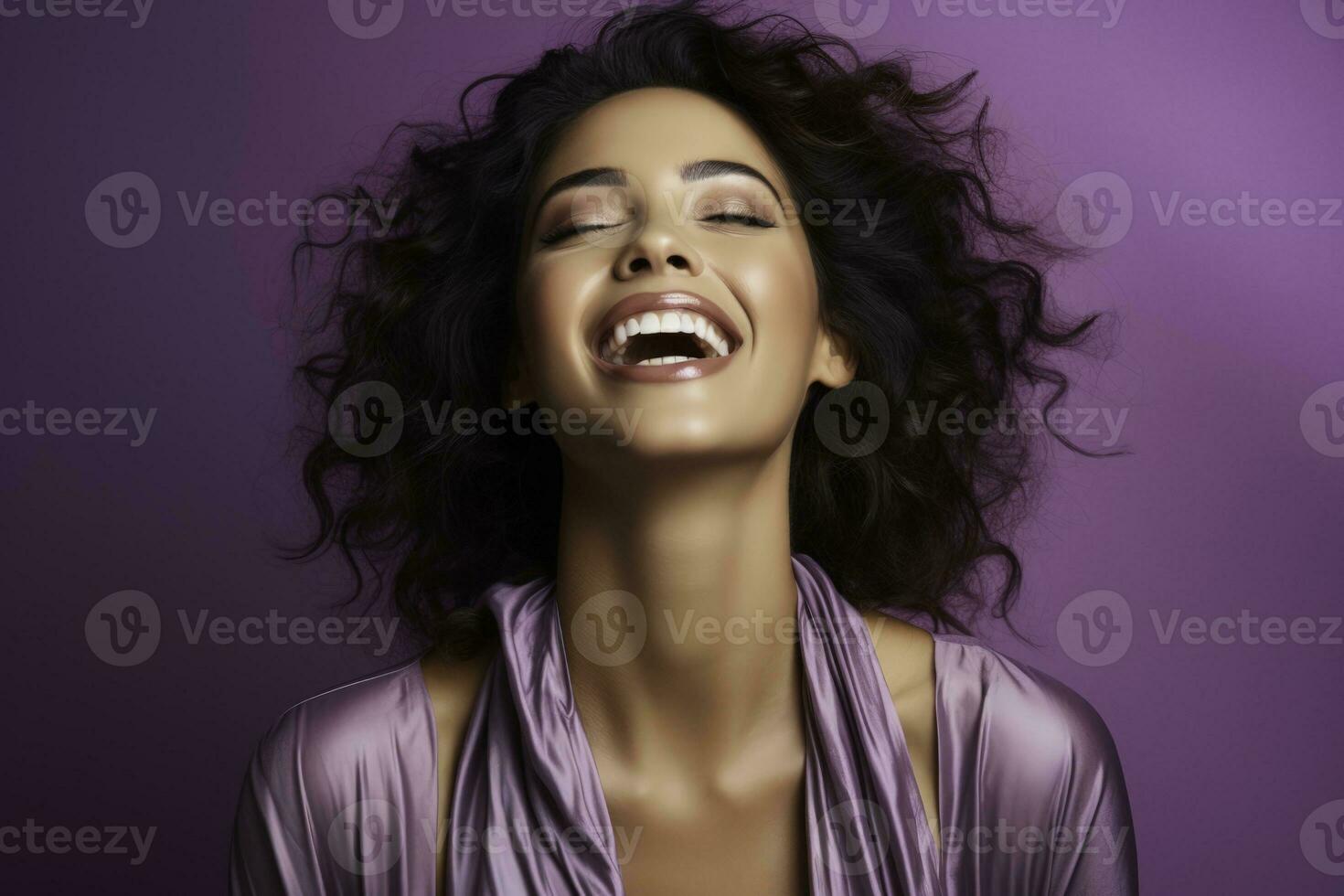 A woman passionately painting her emotions isolated on a purple gradient background photo