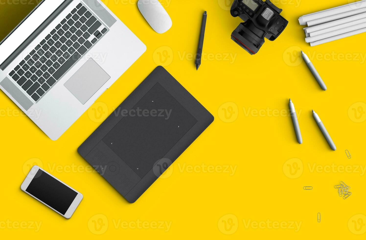 Minimal work space Laptop, camera, coffee, camera, pen, pencil, notebook, smartphone, stationery on yellow background for copy space. photo