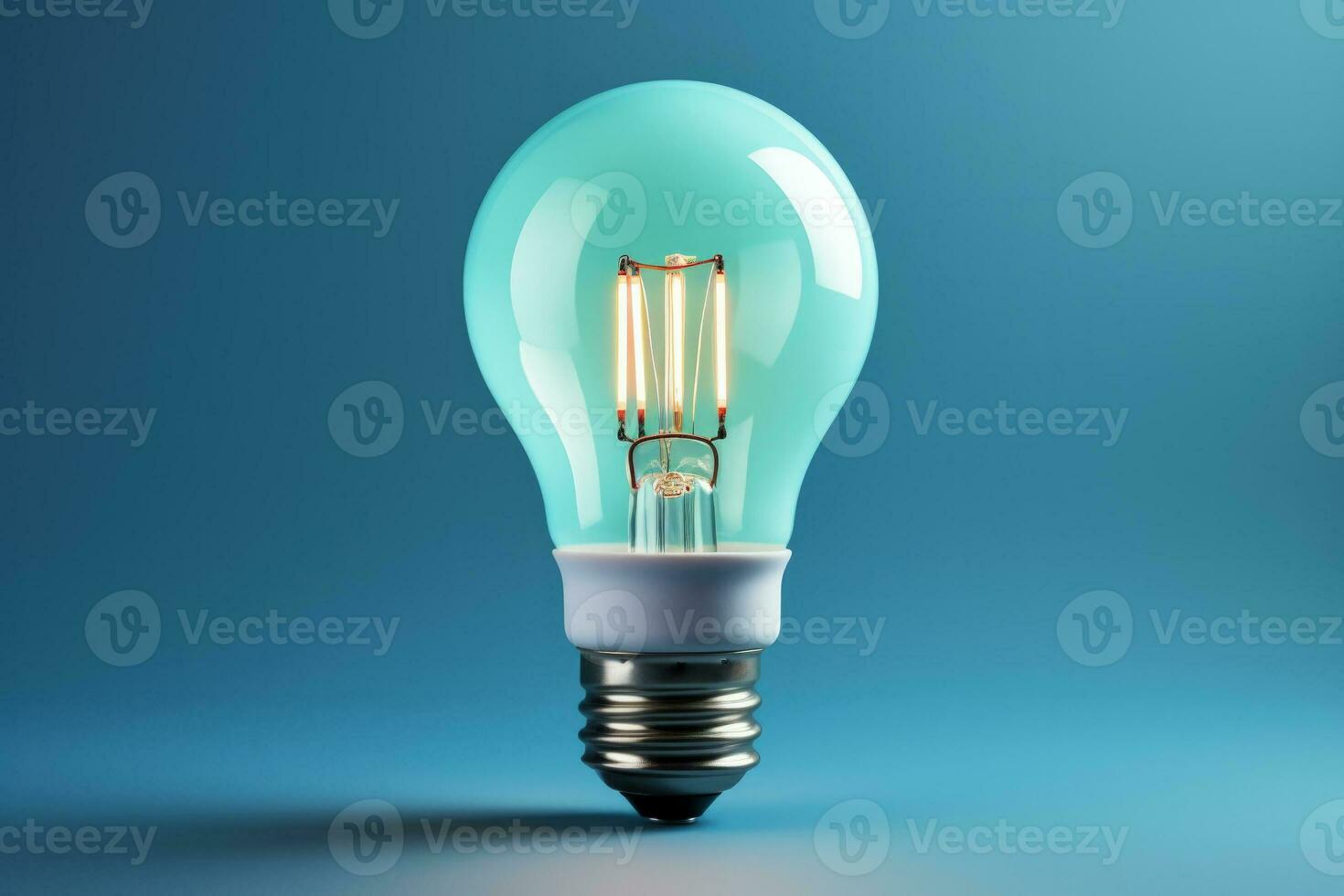 Efficient LED lightbulb glowing isolated on a gradient blue background
