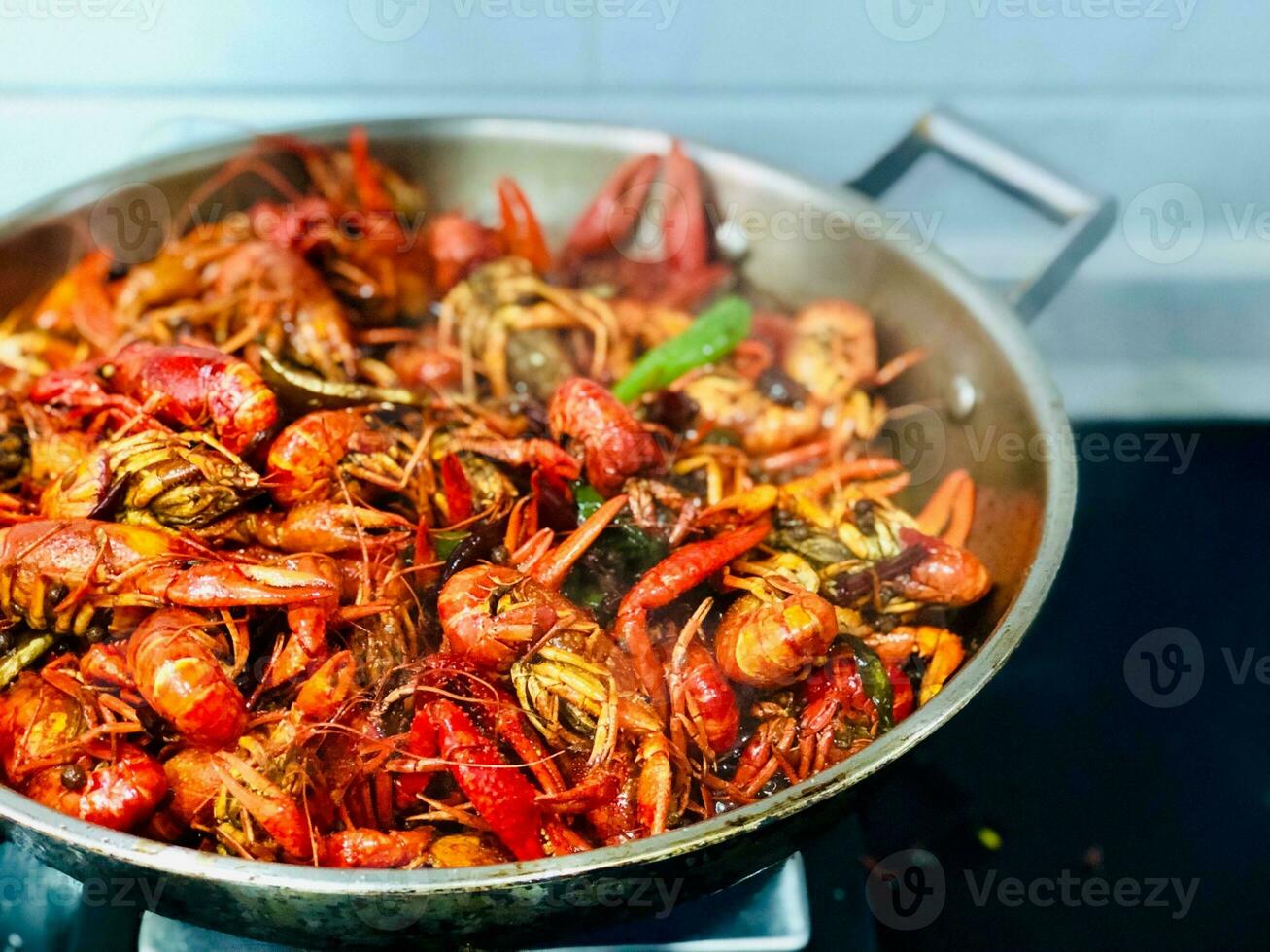 Fried crayfish in a pan on the stove, Thailand. photo