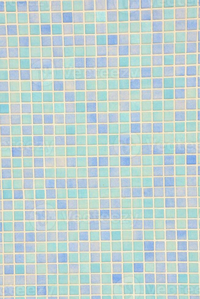 a blue and white mosaic tile wall photo