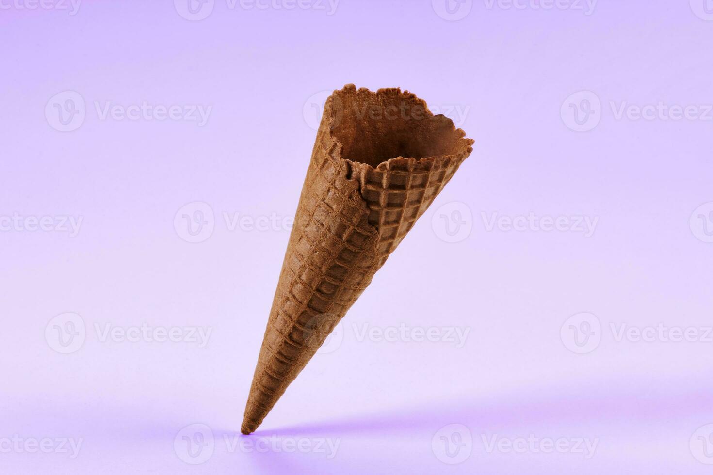 Empty, tasty, chocolate wafer cone for ice cream isolated on white. Concept of food, treats. Mockup, template for advertising and design. Close up photo