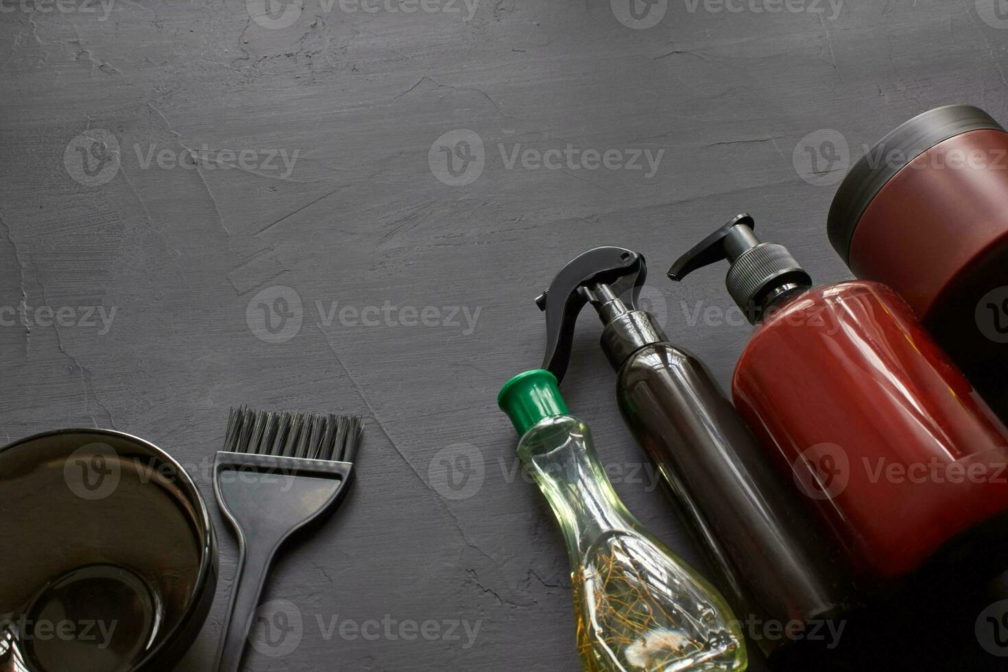 Top view of a professional hairdresser kit with copy space on a black background. photo