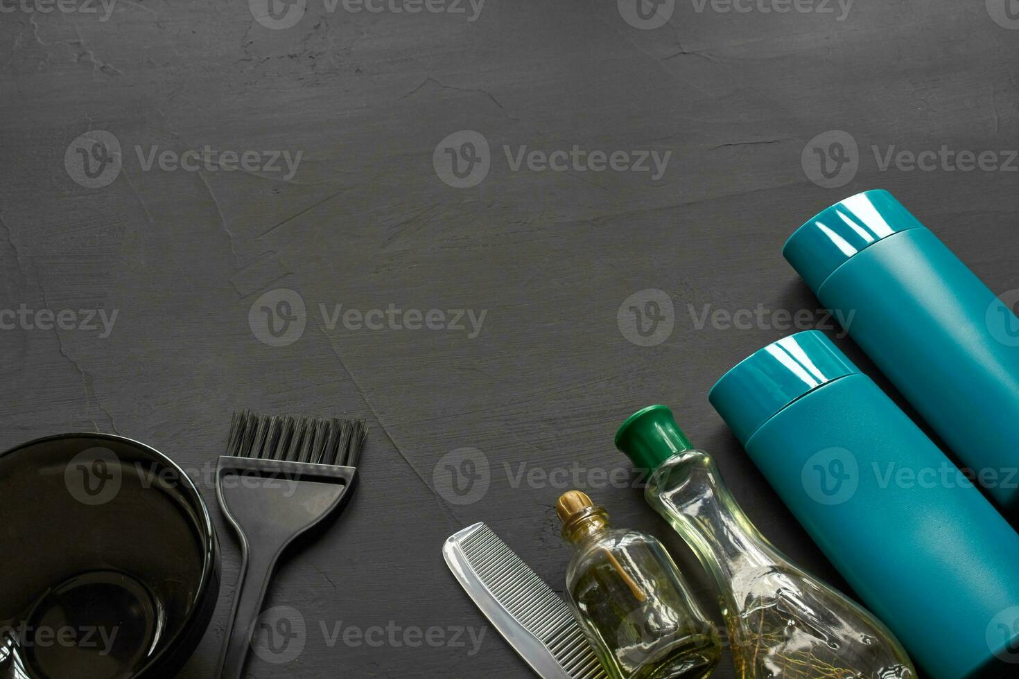 Top view of a professional hairdresser kit with copy space on a black background. photo