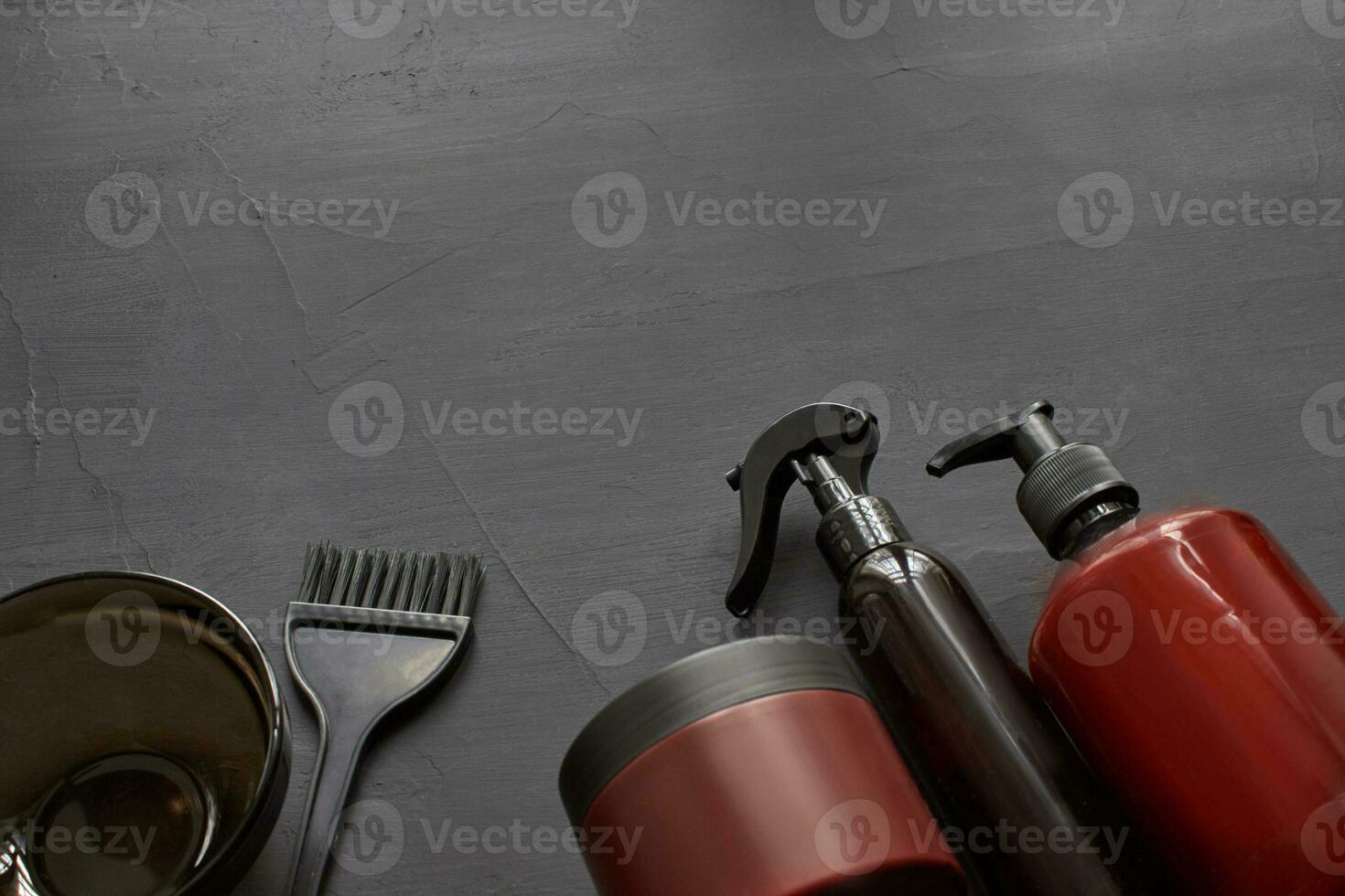 Top view of a professional hairdresser kit with copy space on a black background. photo