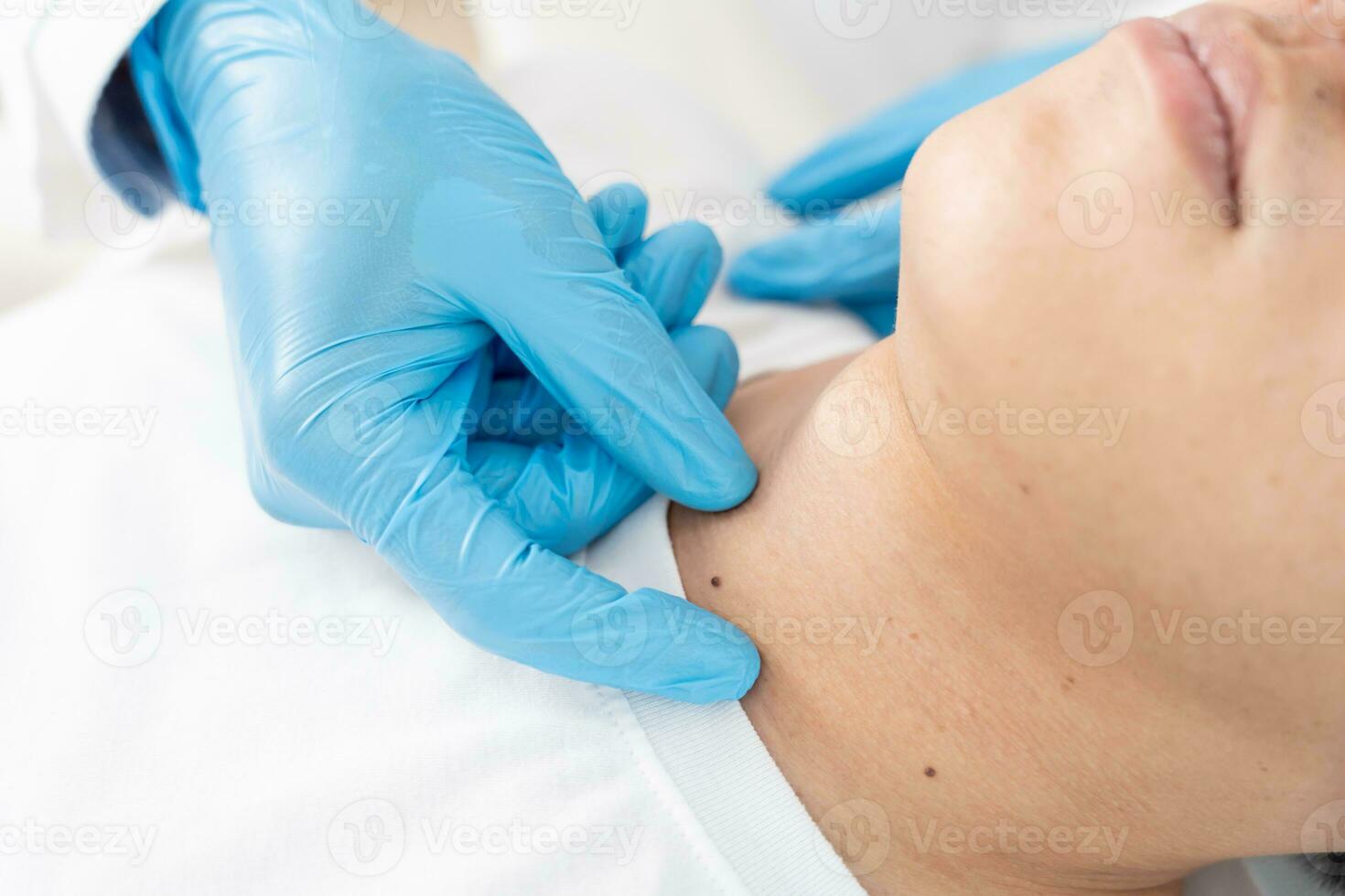 skin problem of asian man. Dermatologist use magnifying glass look itchy skin from skin allergic, steroid allergy, sensitive skin, chemical allergy, rash, insect bites, Dermatitis. photo