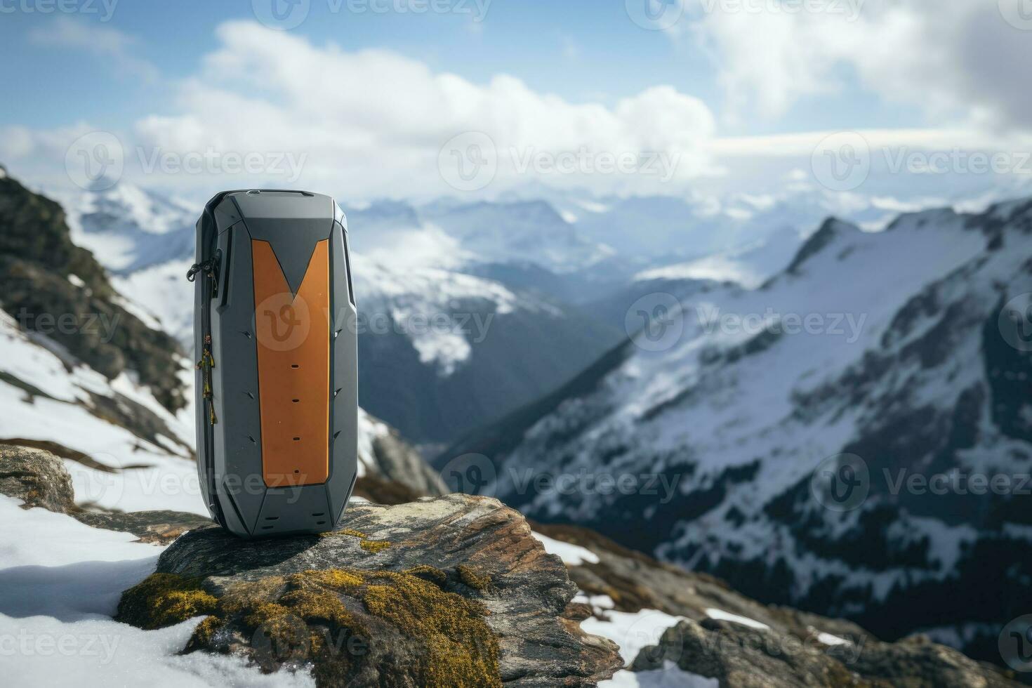 Avalanche beacon amid snowy mountain peaks background with empty space