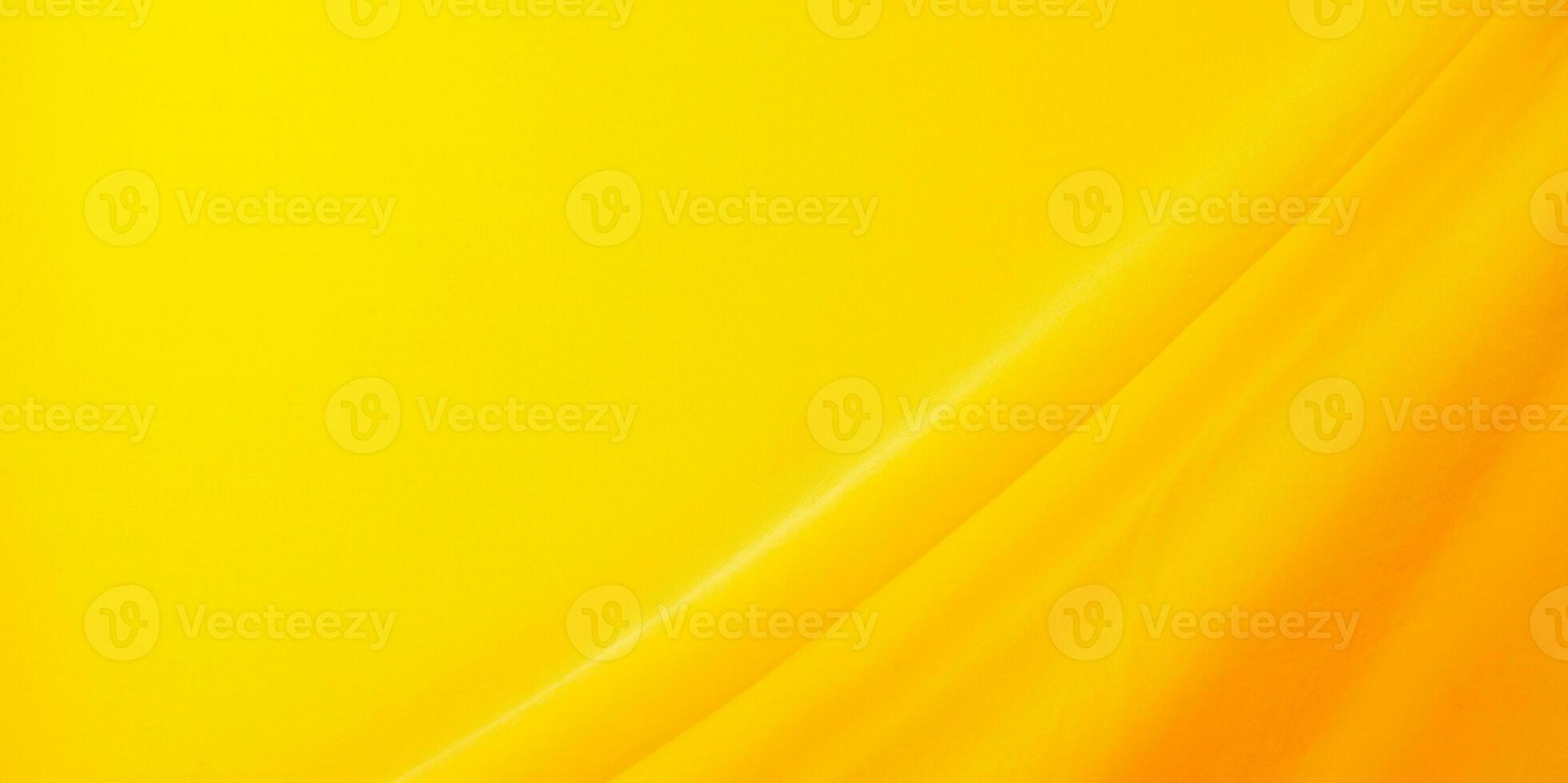 abstract yellow fabric background with waves photo