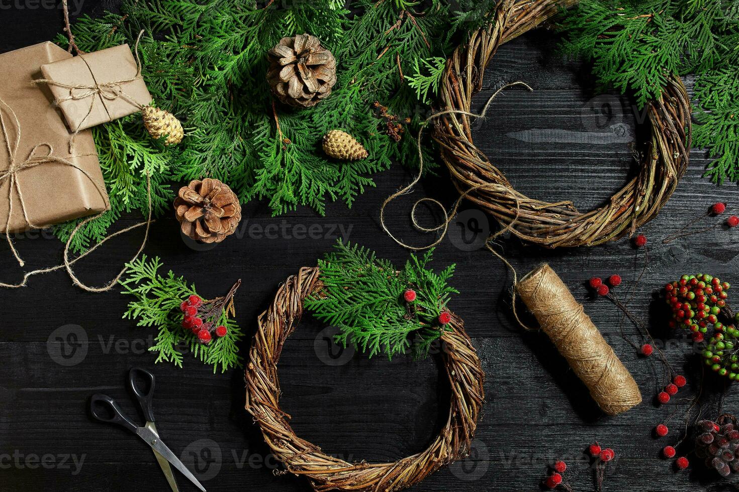 Manufacturer of Christmas decor with their own hands. Christmas wreath for the holiday. The new year celebration. Top view photo