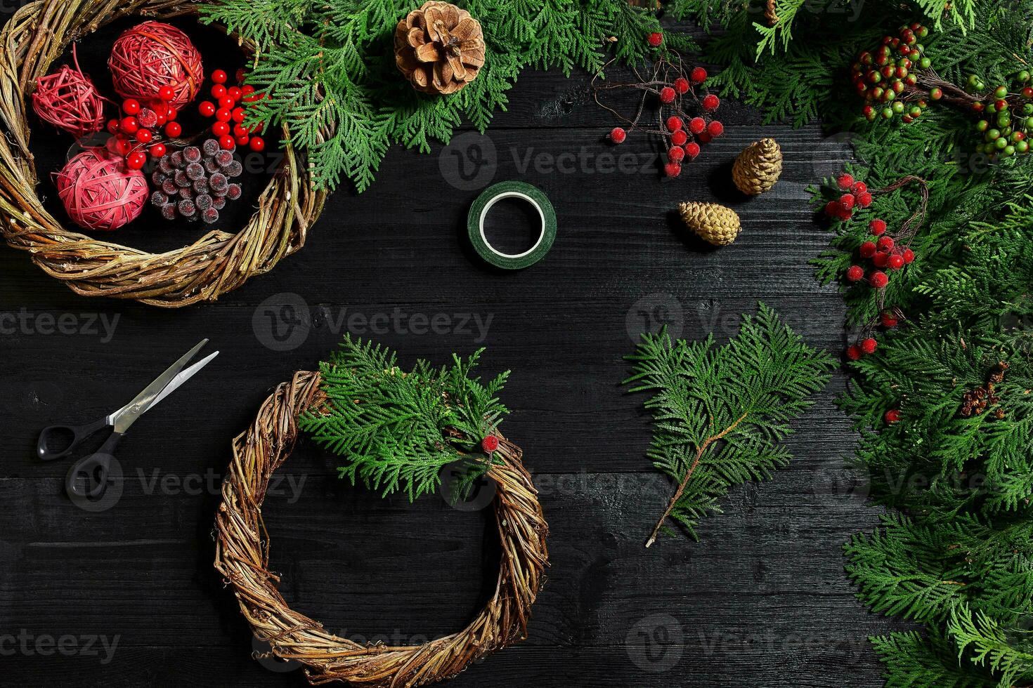 Manufacturer of Christmas decor with their own hands. Christmas wreath for the holiday. The new year celebration. Top view photo