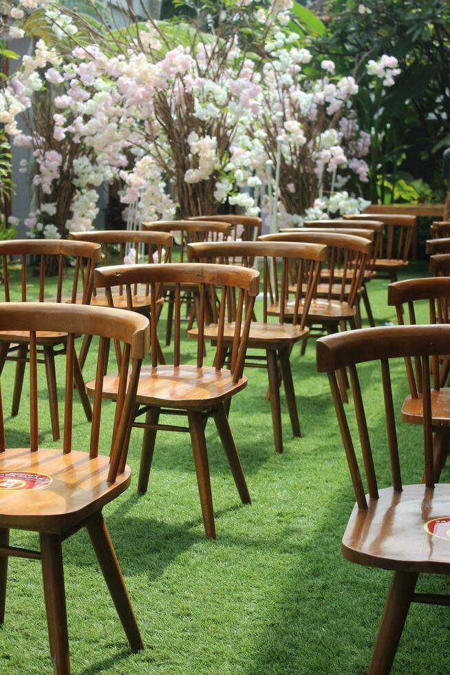 wedding altar and row of brown and white chairs shot at low angle prepared photo