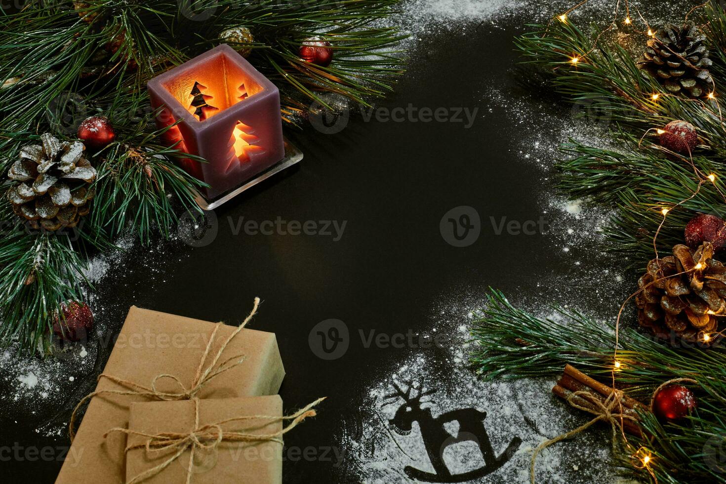 Christmas gifts, christmas tree, candles, colored decor, stars, balls on black background photo