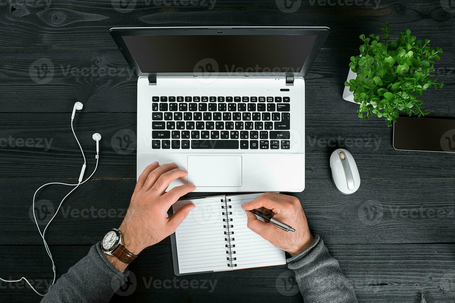 Directly above view of human hands typing on laptop. photo